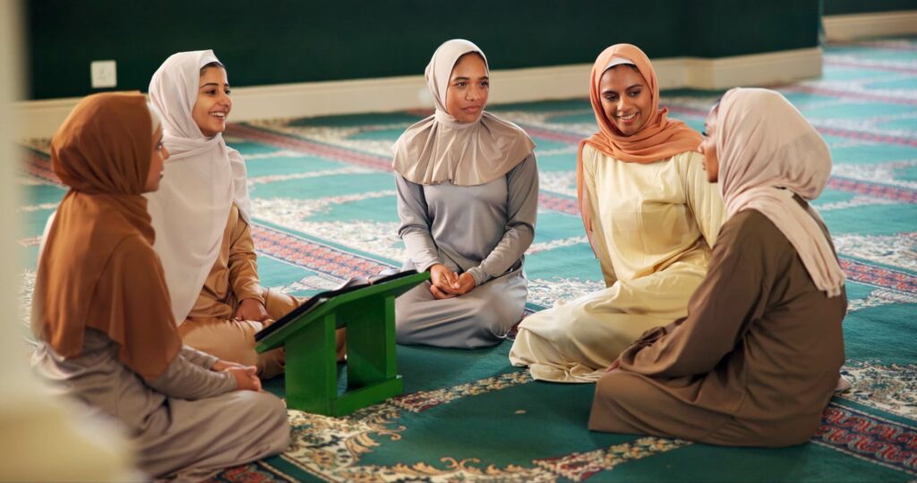 Friends talking or muslim women in mosque learning